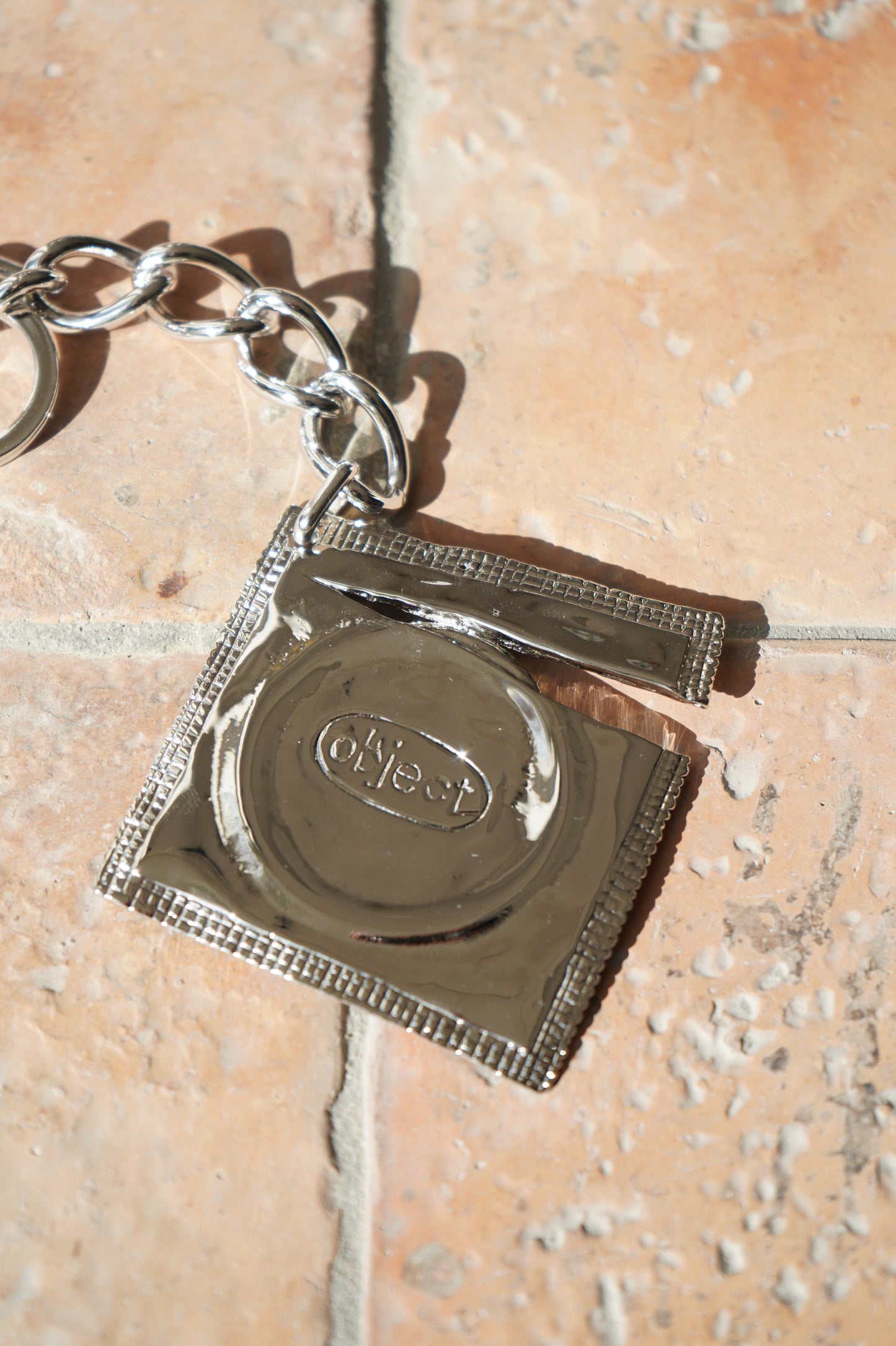 THE OBJECT Ripped Raincoat Keyring